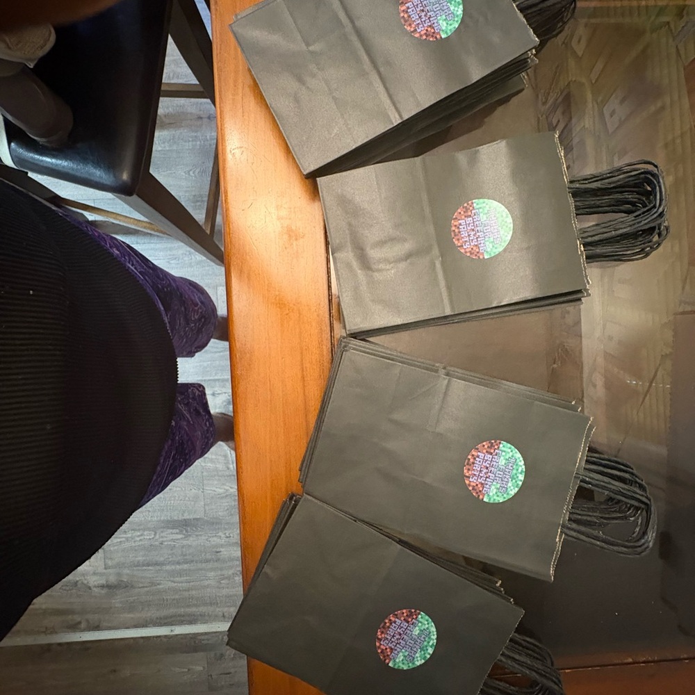 Chic Black Gift Bags with Holographic Accent